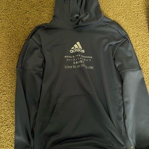Blue adidas hoodie.
